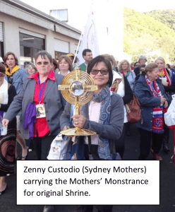 Zenny Custodio of the Sydney Mothers carrying the Mothers' Monstrance in procession